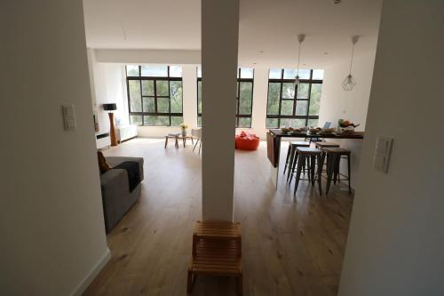 a living room with a couch and a table at Treetops Lisbon Apartment in Lisbon