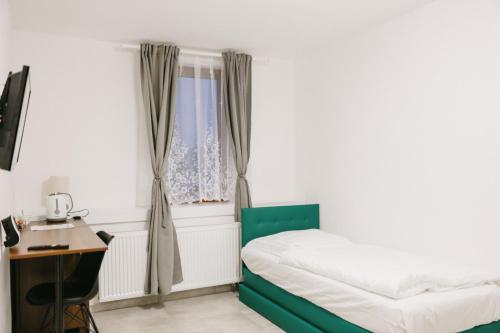 Кровать или кровати в номере OASIS Teplice