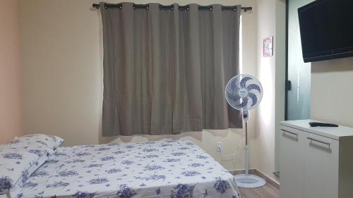 Ένα ή περισσότερα κρεβάτια σε δωμάτιο στο Estilo Residence