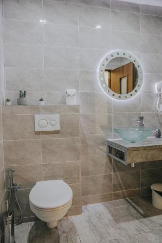 a bathroom with a toilet and a sink at OASIS Teplice in Teplice