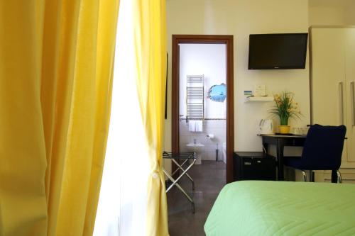 Postel nebo postele na pokoji v ubytování Vatication B&B