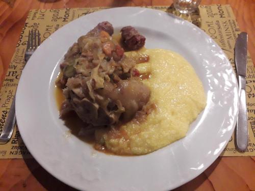 a white plate of food on a table at Agriturismo Il Balcone sulla Valle in Bedero Valcuvia