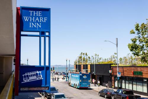 a sign for the water inn on a city street at The Wharf Inn in San Francisco