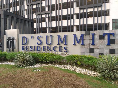 a sign in front of a building at D Summit Cozy Homestay in Skudai