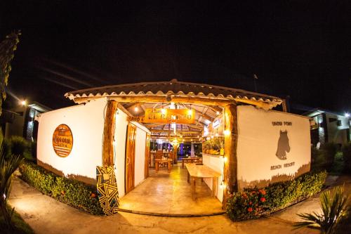 a food trailer with a table in the doorway at night at Show Pony Beach Resort and Suites in Las Lajas