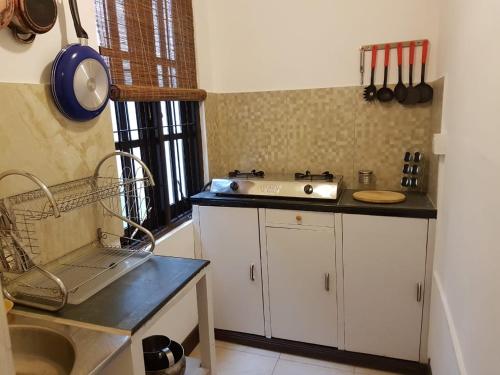 a kitchen with a sink and a counter top at MJM Villa in Colombo