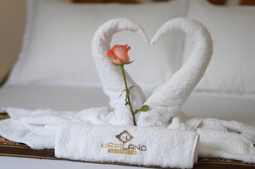 Postel nebo postele na pokoji v ubytování MAPILAND- Hotel Boutique