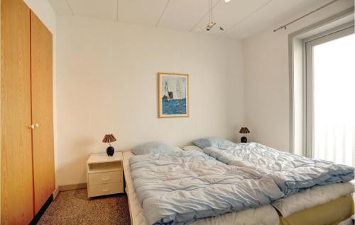 Кровать или кровати в номере Strandpromenaden