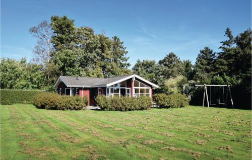 a house with a large yard in front of it at Three-Bedroom Holiday Home In Humble in Humble