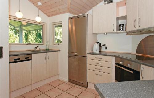 A kitchen or kitchenette at Nice Home In Grlev With 3 Bedrooms And Sauna