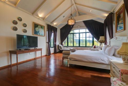 Postel nebo postele na pokoji v ubytování Chateau de Prim Khao Yai