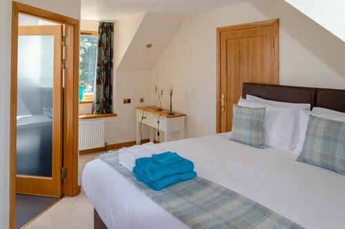 Кровать или кровати в номере Castleview @ Newton Steading Farm