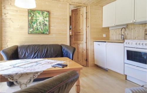 a kitchen with a couch and a table in a room at Gorgeous Home In Dirdal With Wifi in Dirdal
