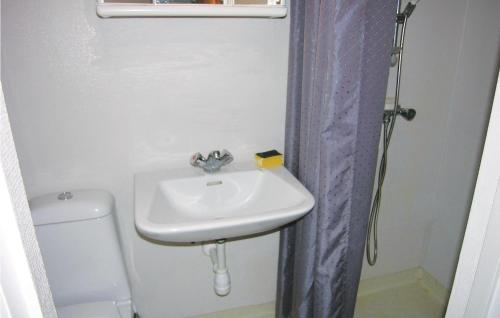 a bathroom with a sink and a toilet at Stunning Apartment In Allinge With Wifi in Allinge