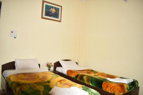 Een bed of bedden in een kamer bij Sakura House