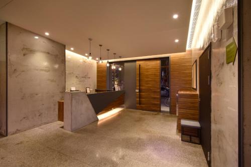 a hallway of a house with a counter in the middle at Goodmore Hotel in Taipei