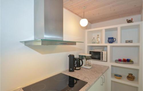 a kitchen with a sink and a counter top at 2 Bedroom Nice Home In Stege in Stege