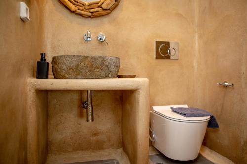 a bathroom with a sink and a toilet at VILLA AGAPITOS in Naxos Chora