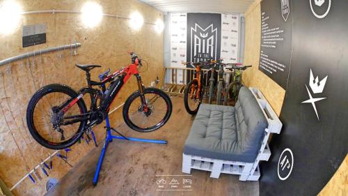 two bikes parked on a bike rack in a room at Bike Park Lodge in Merthyr Tydfil