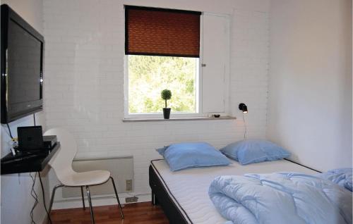Katil atau katil-katil dalam bilik di Gorgeous Home In Dannemare With Wifi