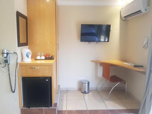 Kuchyň nebo kuchyňský kout v ubytování Europrime Hotel