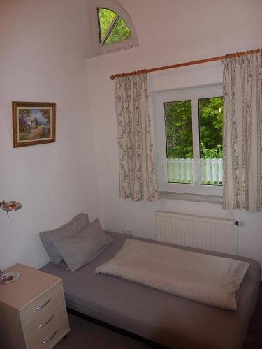 Ένα ή περισσότερα κρεβάτια σε δωμάτιο στο Ferienhaus Feist