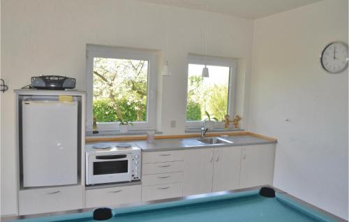  Amazing home in Grenaa with 8 Bedrooms, WiFi and Indoor swimming pool -  Room  picture :   Tea/Coffee maker    Shower    TV                           