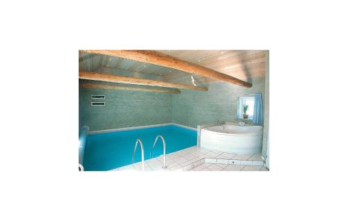  Amazing home in Grenaa with 8 Bedrooms, WiFi and Indoor swimming pool -  Room  picture :   Tea/Coffee maker    Shower    TV                           