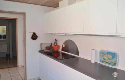  Amazing home in Grenaa with 8 Bedrooms, WiFi and Indoor swimming pool -  Room  picture :   Tea/Coffee maker    Shower    TV                           