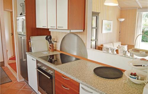 a kitchen with a sink and a counter top at Stunning Home In Vejby With Wifi in Vejby
