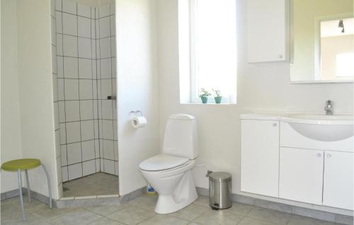  Amazing home in Grenaa with 8 Bedrooms, WiFi and Indoor swimming pool -  Room  picture :   Tea/Coffee maker    Shower    TV                           
