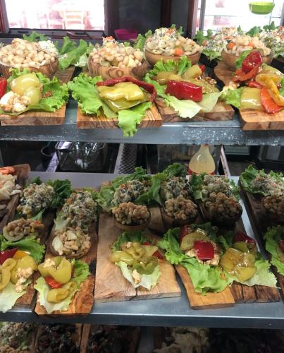 a display case with lots of different types of food at Vila Pepaj Razem in Razëm
