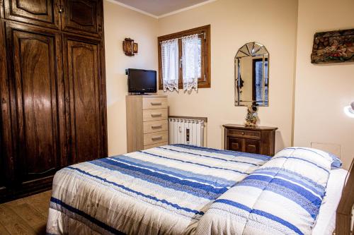 Кровать или кровати в номере Appartamento Valeria