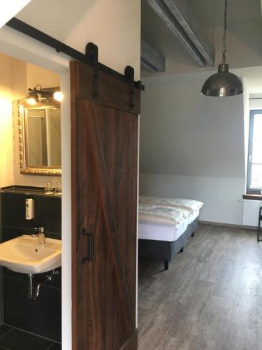 Postel nebo postele na pokoji v ubytování Hugos Haus & Berthas Haus