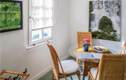 a dining room with a table and chairs and a window at Lovely Apartment In Linz Am Rhein in Linz am Rhein
