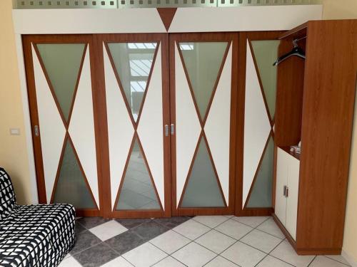 a room with sliding glass doors in a room at Playa Apartment 230 - 230 bis in Catania