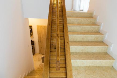 a staircase with wooden treads in a house at Montana Residence in Poiana Brasov