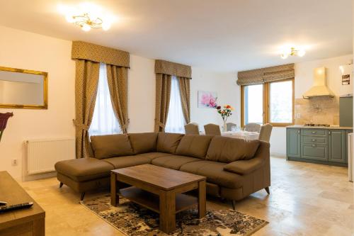 a living room with a couch and a table at Montana Residence in Poiana Brasov