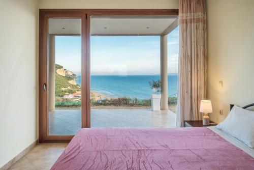 En eller flere senge i et værelse på Villa Belle Plaza