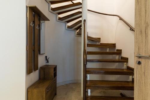 a staircase in a house with wooden steps at Montana Residence in Poiana Brasov