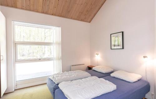 Rubinsøen Skovhuseにあるベッド