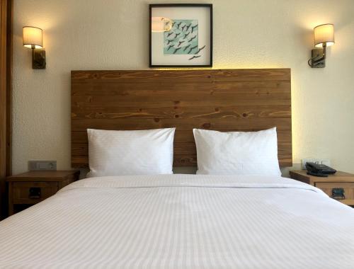 Letto o letti in una camera di 8 Rooms Hotel