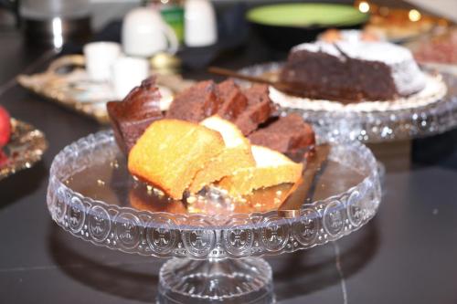 a plate of chocolate desserts on a table at Casa Vittoria Napoli - Santa Lucia in Naples