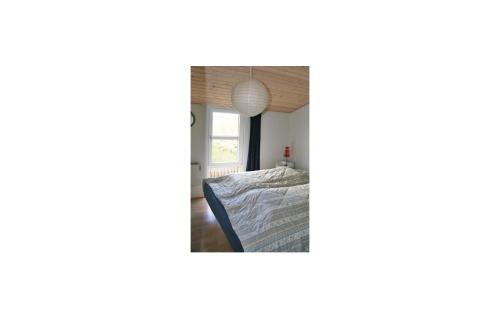 Postel nebo postele na pokoji v ubytování 2 Bedroom Stunning Home In Fan