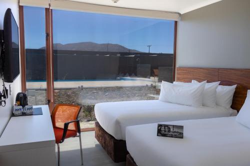 Postel nebo postele na pokoji v ubytování Park Inn by Radisson Los Olivos de Vallenar