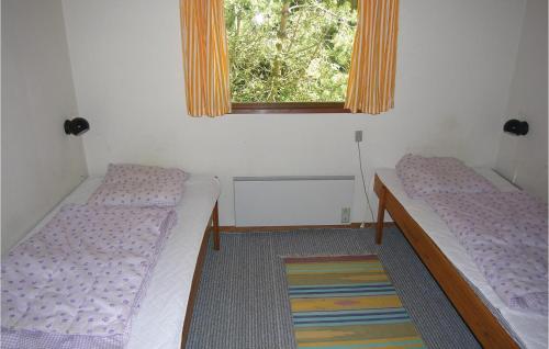 Katil atau katil-katil dalam bilik di Holiday Home Stenbækvej Humble Xi