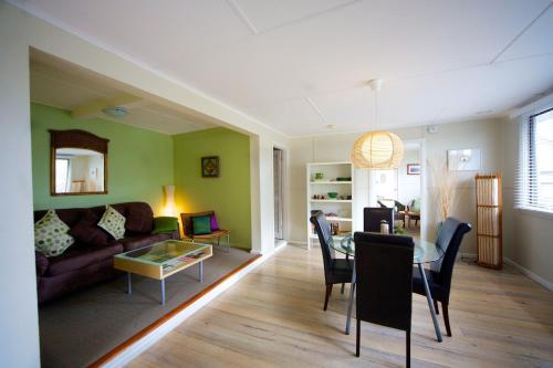 a living room with a couch and a table at Healesville Apartments in Healesville