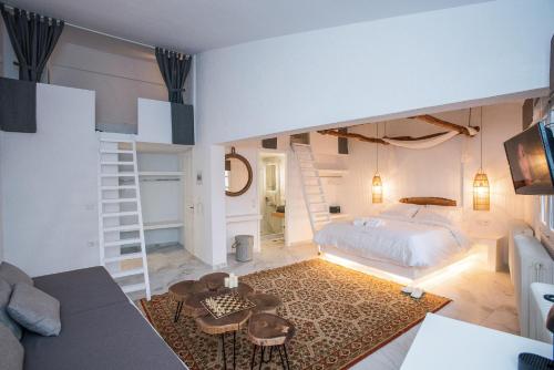 a bedroom with a bed and a living room at Blue Mountain Guesthouse by Seablue in Arachova