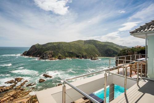a view of the ocean from the balcony of a house at Head over Hills in Knysna