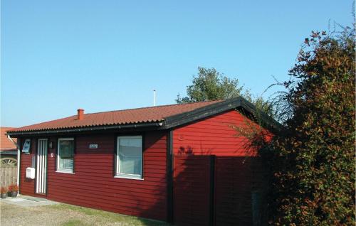 a red house with a red roof at Mindegården in Hejls